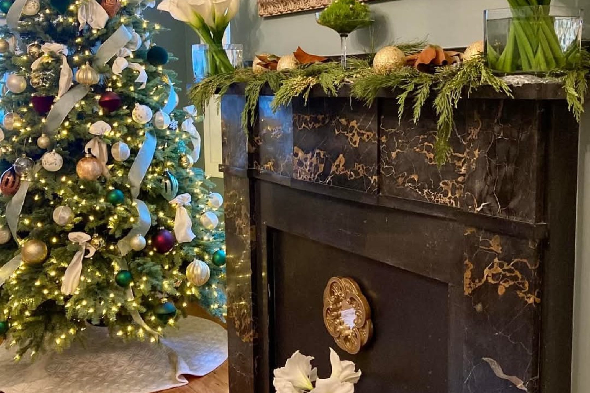 a fireplace decorated for christmas